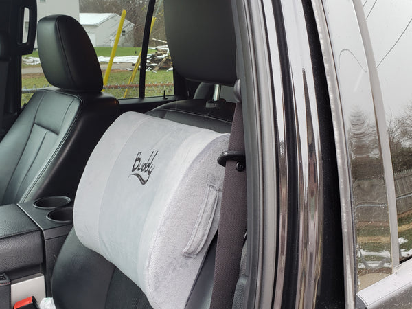 Lumbar support pillow in a car
